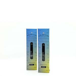 Two Palmetto Hemp Supply disposable vapes in boxes standing upright. The vape boxes are blue fading into yellow gradient with hemp leaves on them.